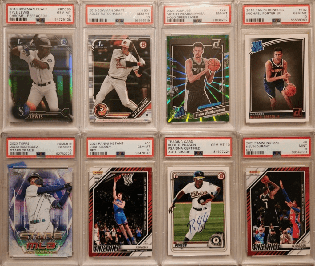 An assortment off different PSA graded baseball and basketball trading cards.
